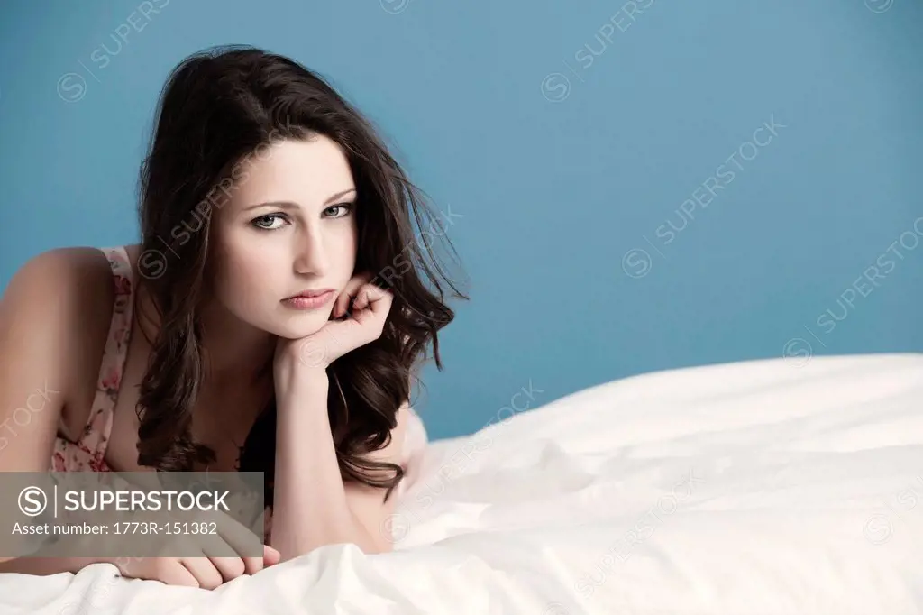 Teenage girl laying on bed