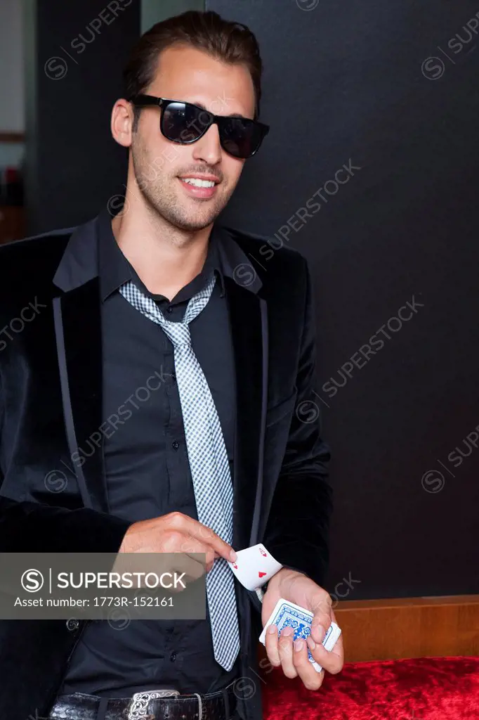 Man slipping cards up his sleeve