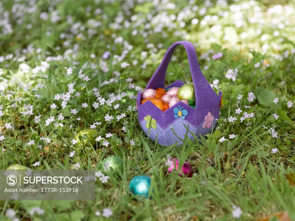 Basket of Easter eggs in grass