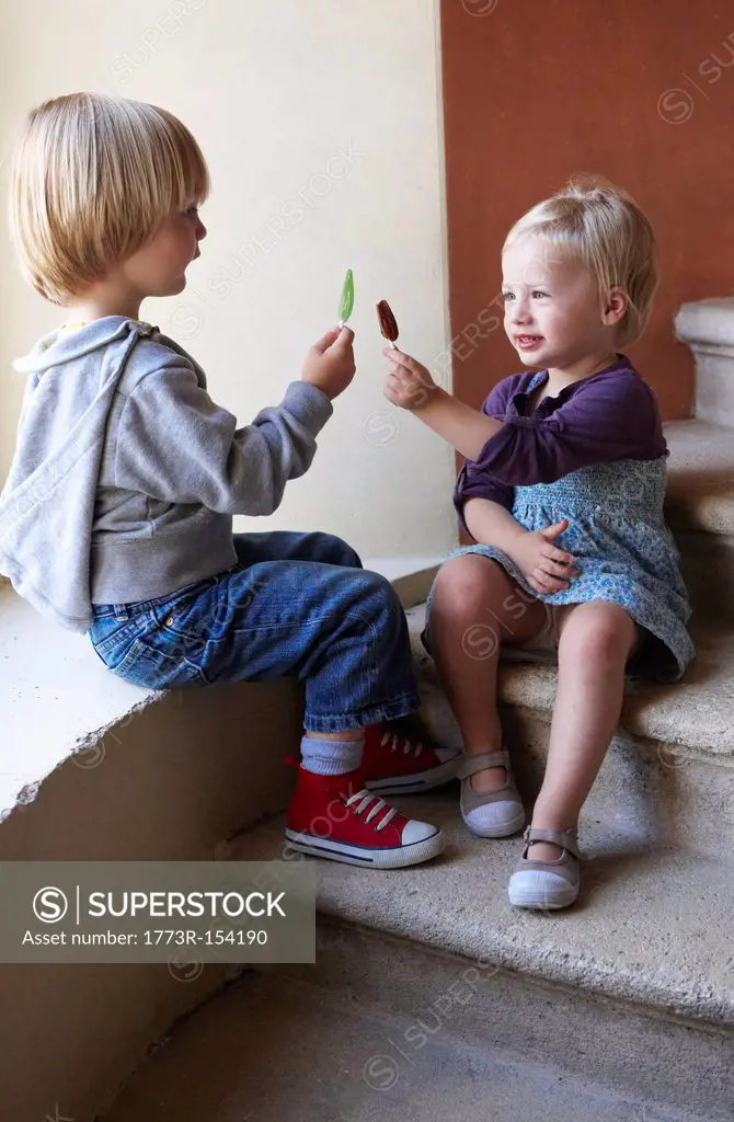 Children comparing popsicle sticks