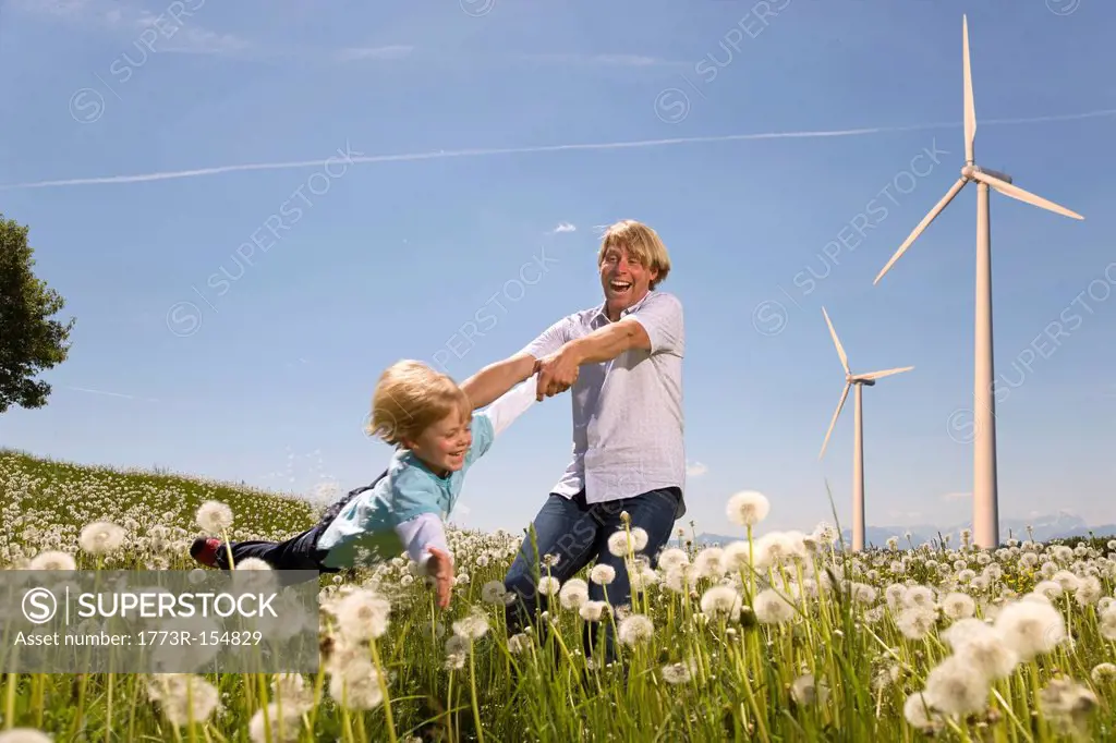 Father and son with wind turbines