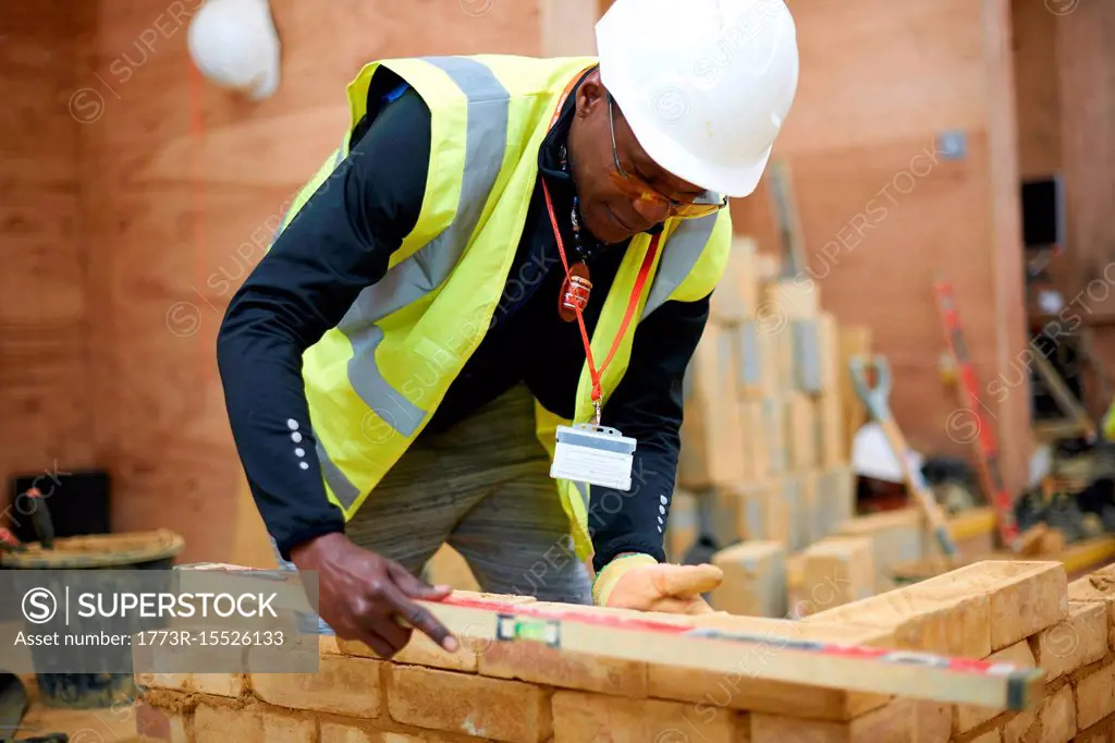 Lecturer building brick wall in classroom