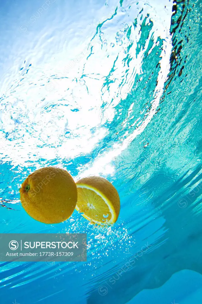 Lemon floating in swimming pool