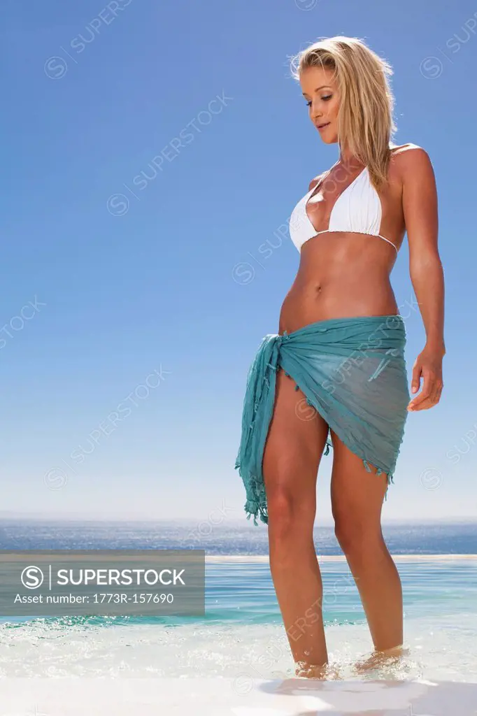 Woman in bikini walking in pool