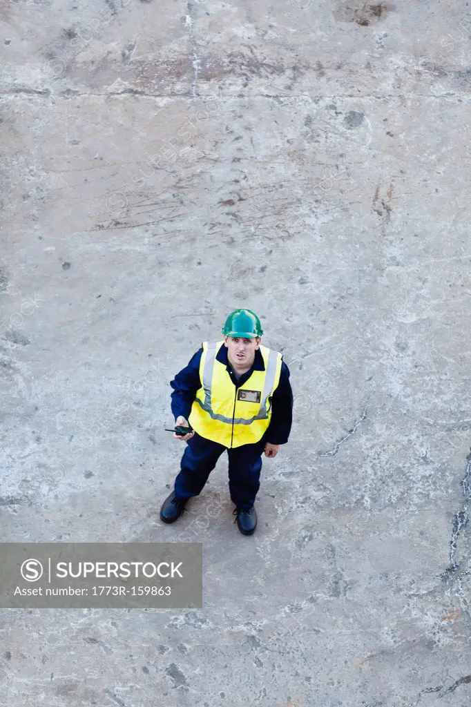 Worker standing on dry dock