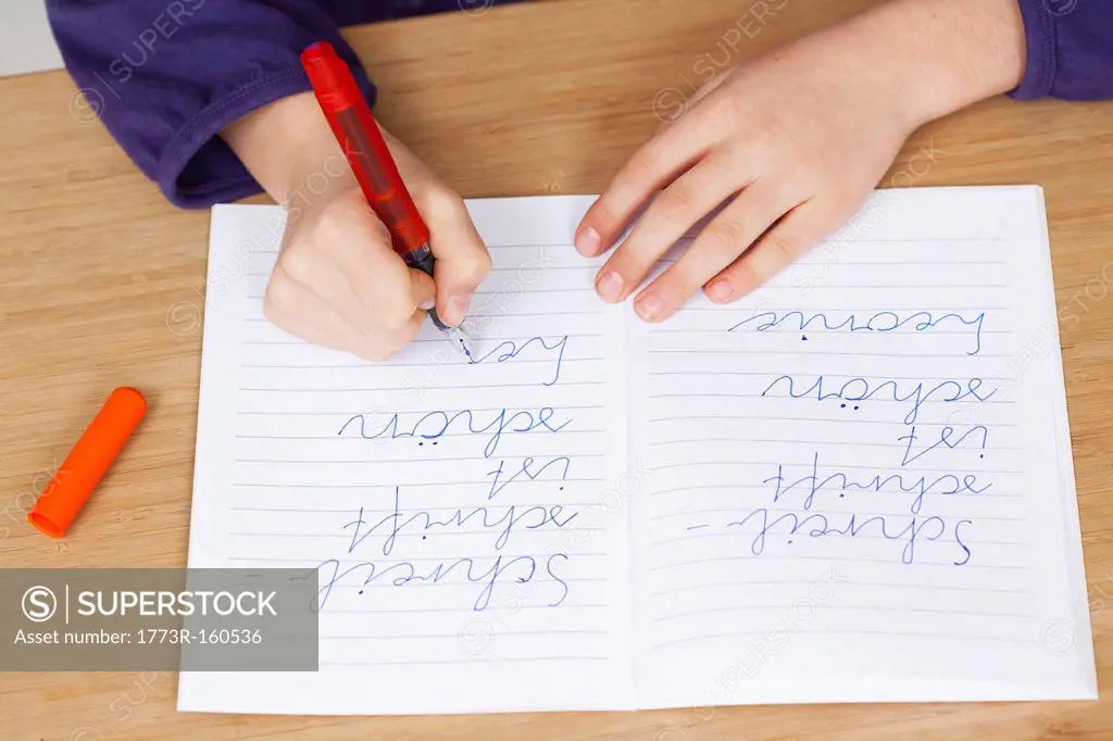 Student practicing handwriting in class
