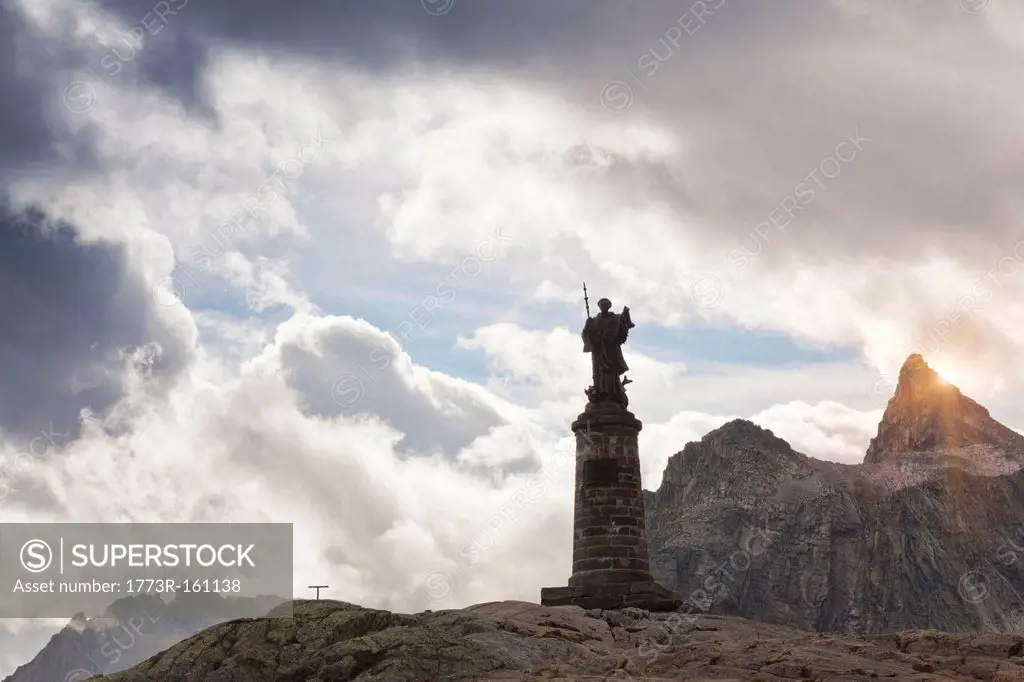 Ornate statue on rocky mountaintop