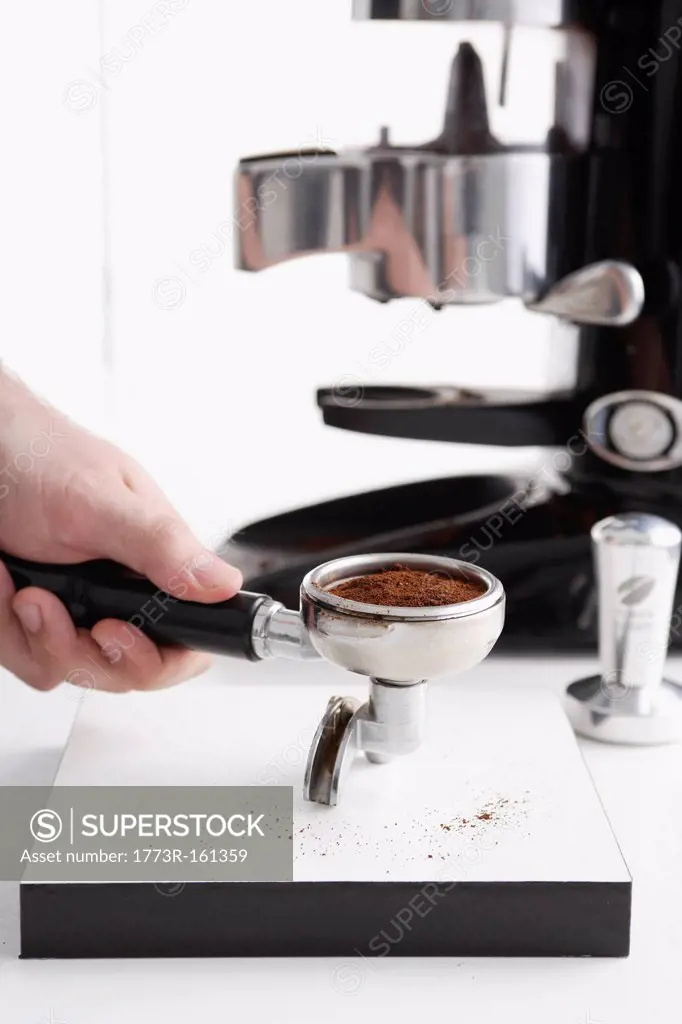 Barista using espresso machine