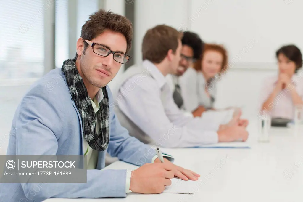 Businessman making notes in meeting