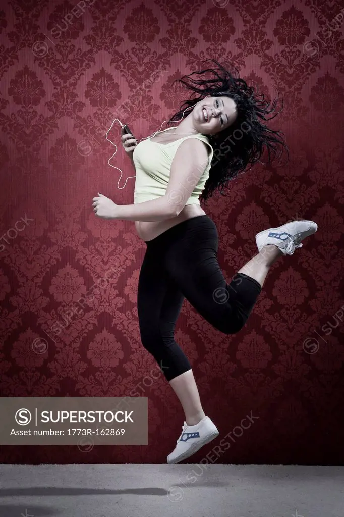 Woman listening to headphones in workout