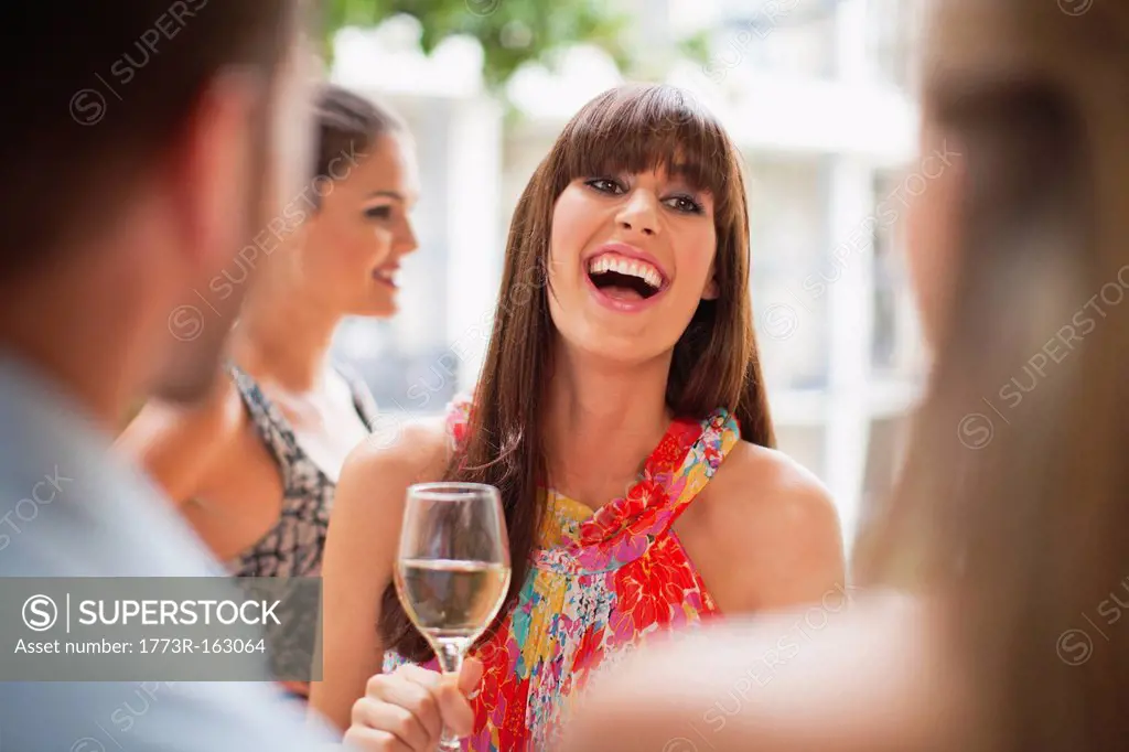 Woman talking in group at party