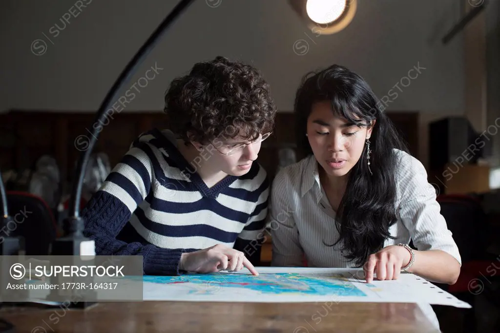 Students reading map in class