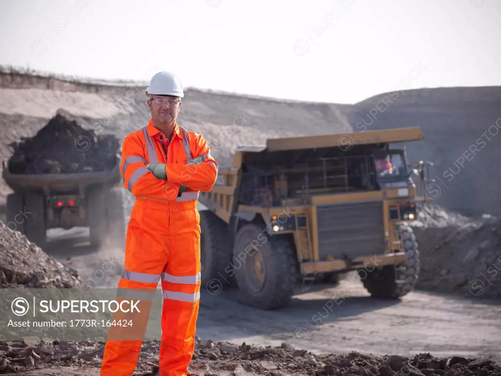 Worker standing at coal mine