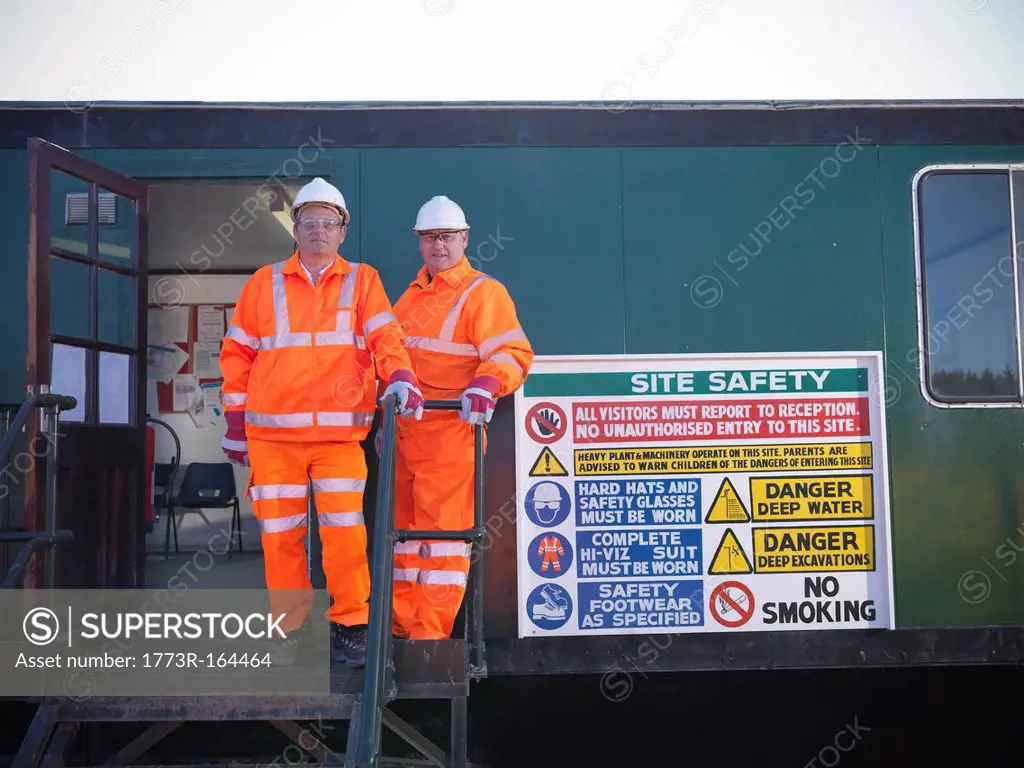 Workers by safety sign at coal mine