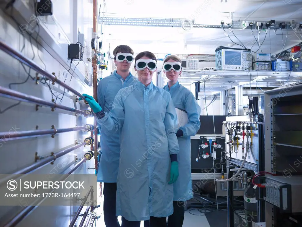 Scientists wearing goggles in lab