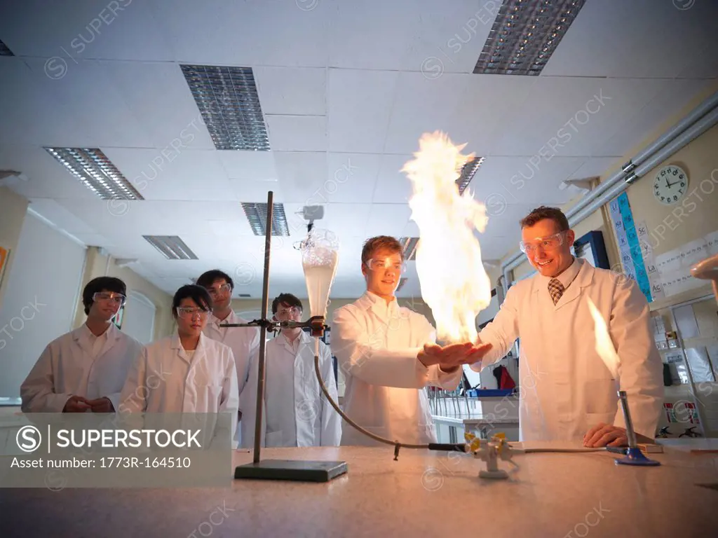 Chemistry teacher and students in lab