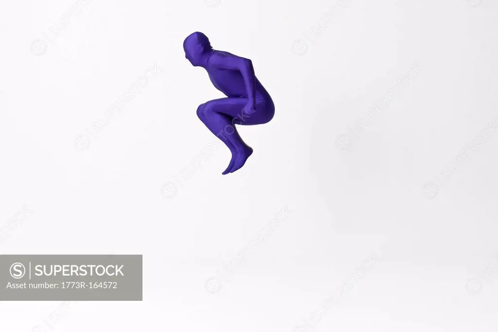 Man in bodysuit jumping