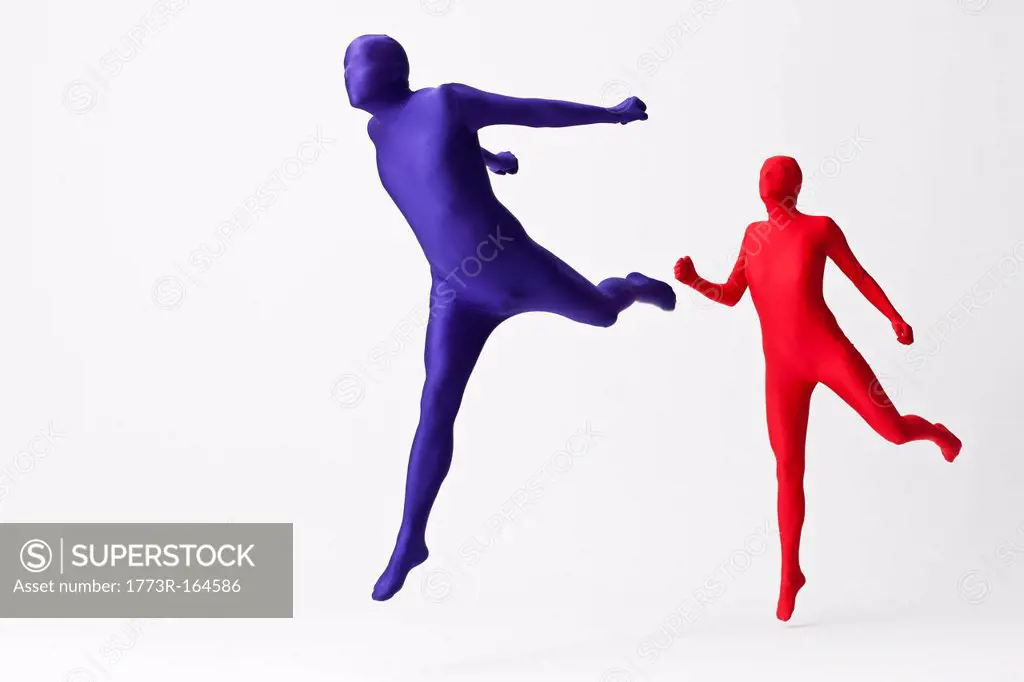 Couple in bodysuits jumping