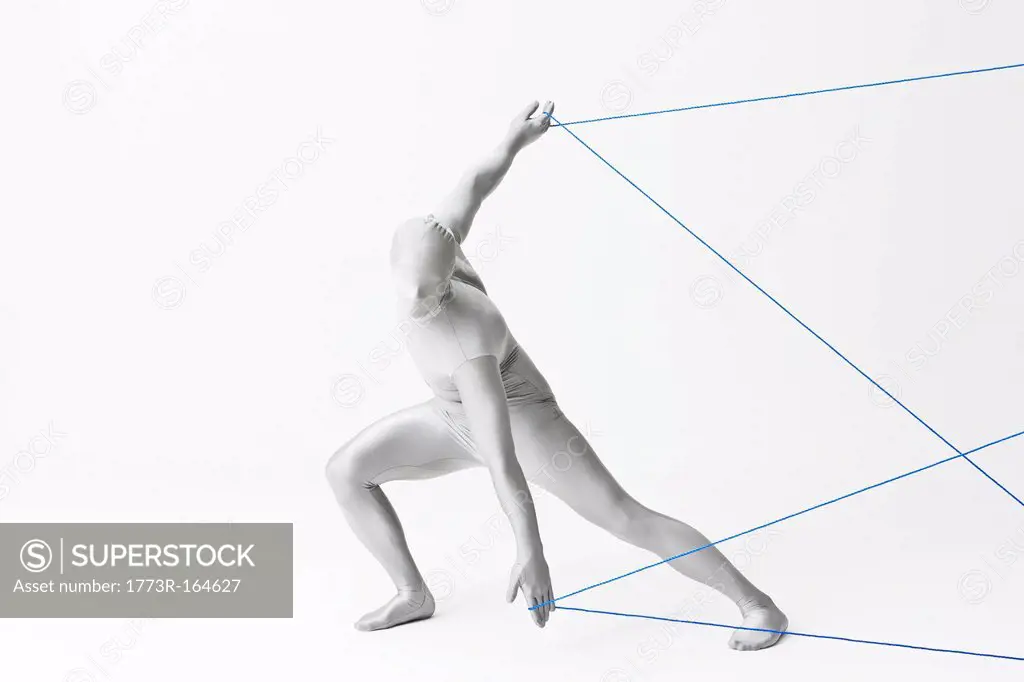 Man in bodysuit playing with string