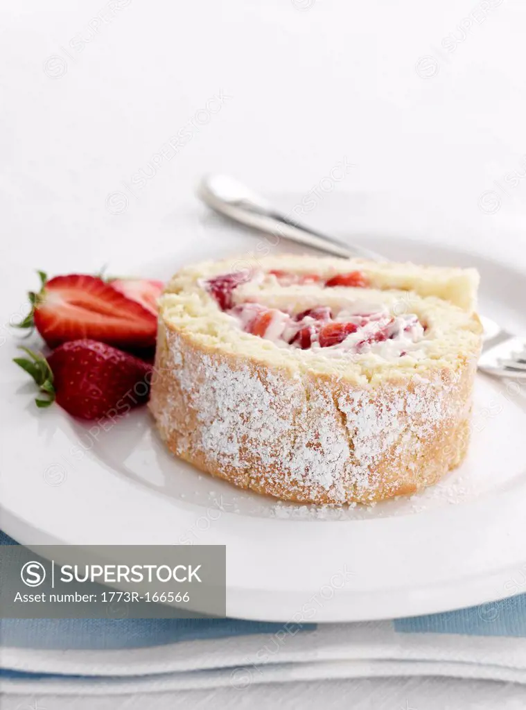 Plate of strawberry swiss roll
