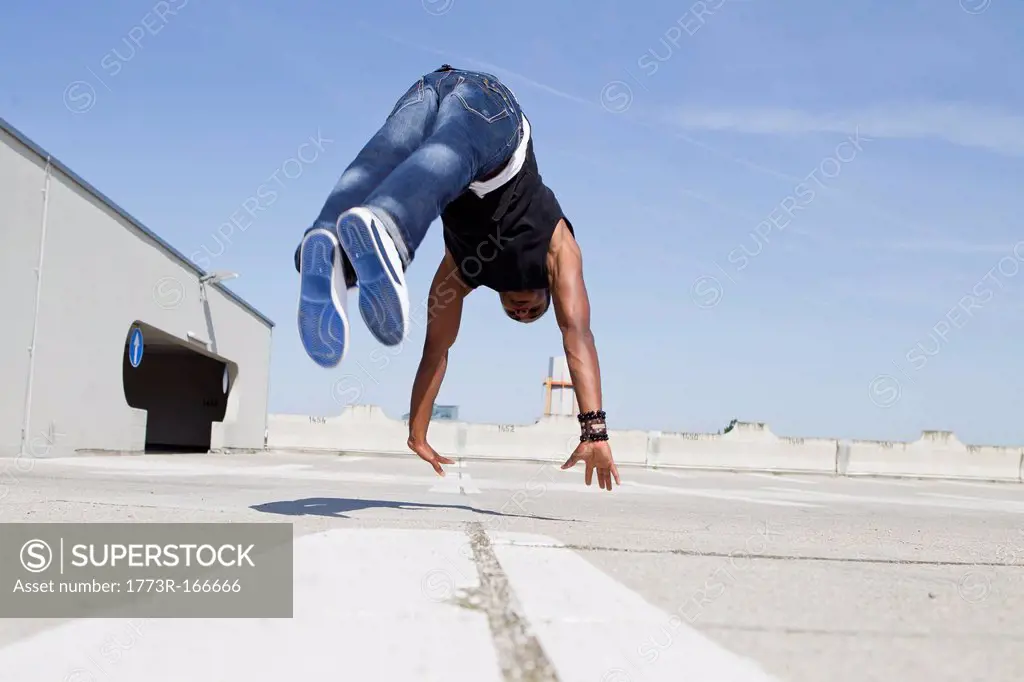 Man jumping on rooftop