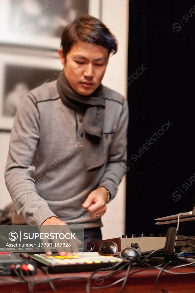 Musician playing with synthesizer