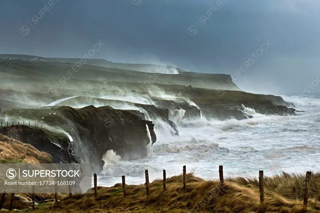 Waves crashing on rocky cliffs