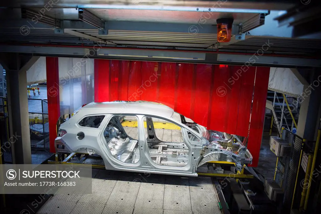 Car body with robots on production line in car factory