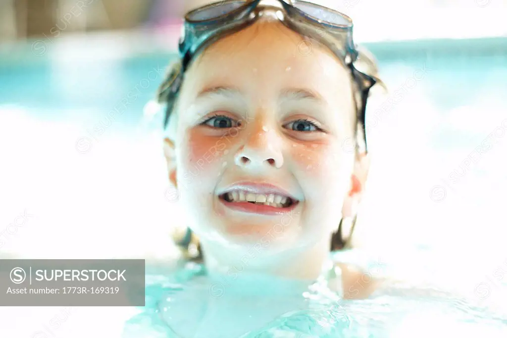 Close up of girl swimming in pool