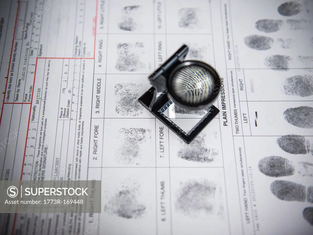 Loupe over fingerprints on arrest form