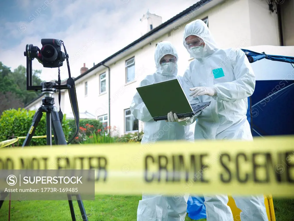 Forensic scientists at crime scene