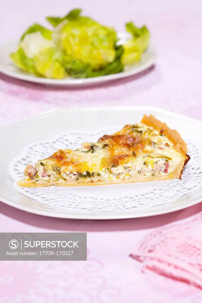 Plate of quiche with salad