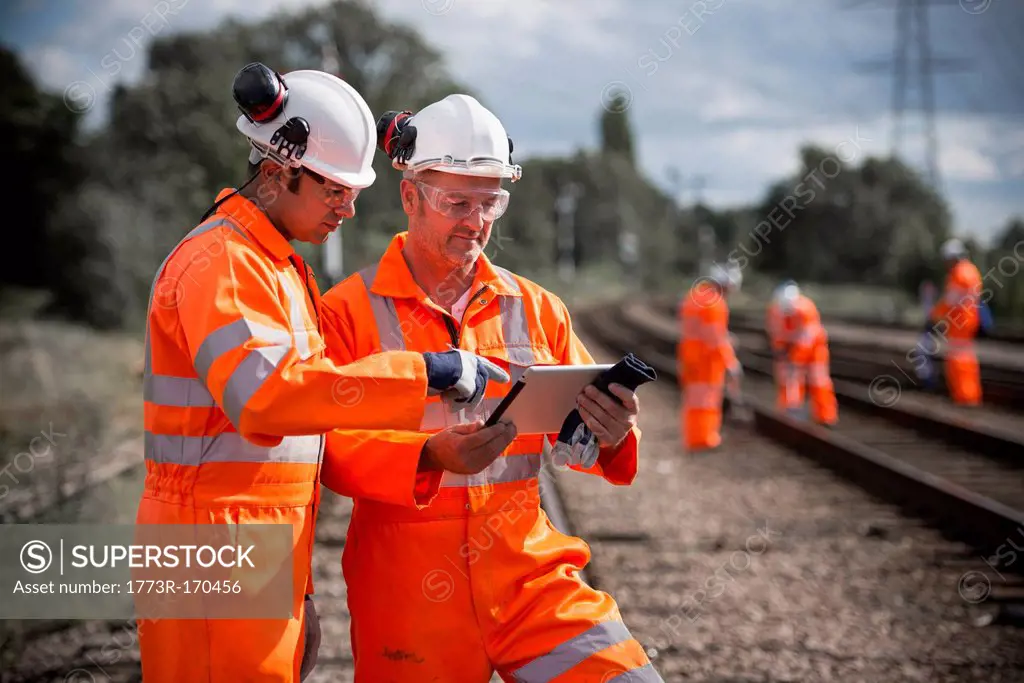 Railway workers using tablet computer
