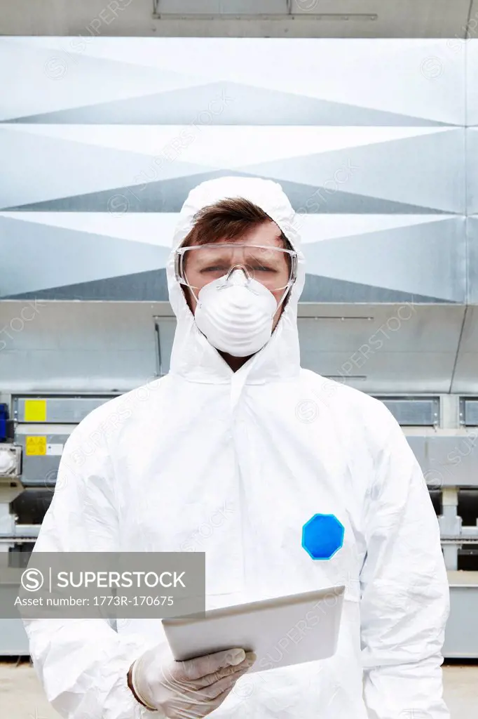 Lab worker wearing hazmat suit