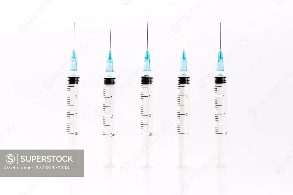 Row of blue syringes