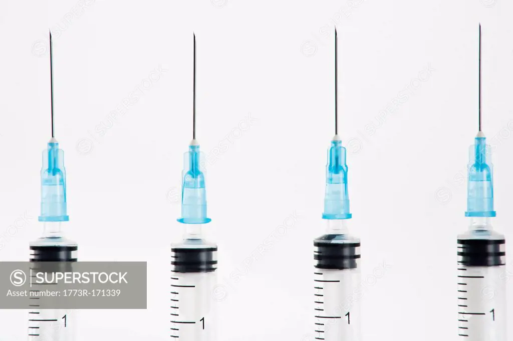 Row of blue syringes