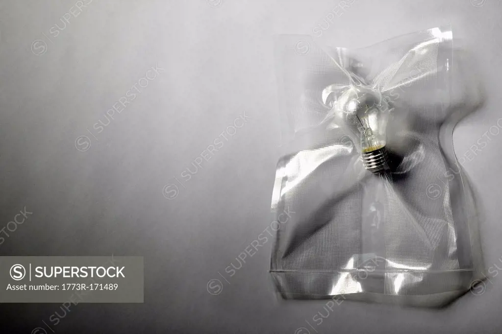 Light bulb shrink wrapped in plastic