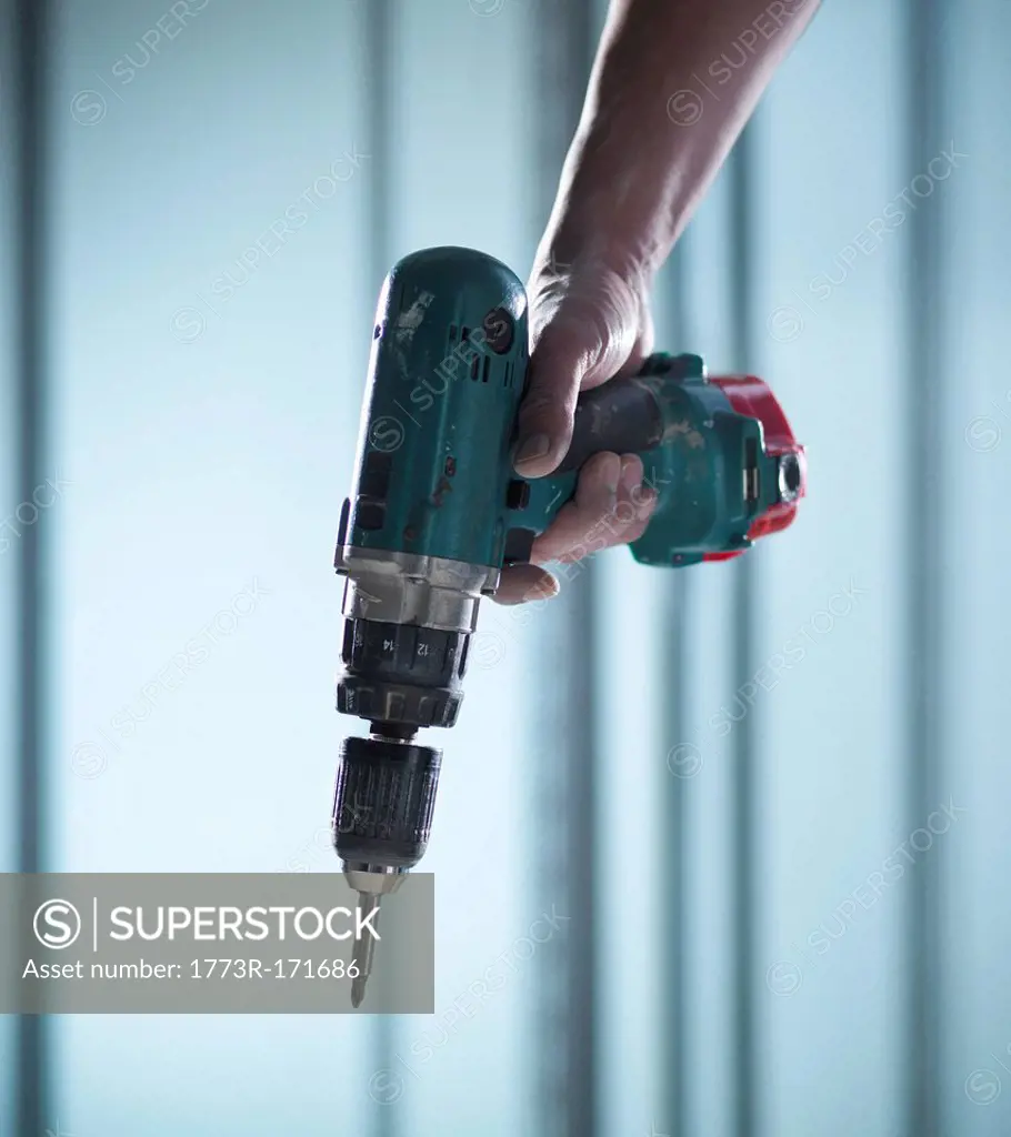 Close up of hand holding power drill