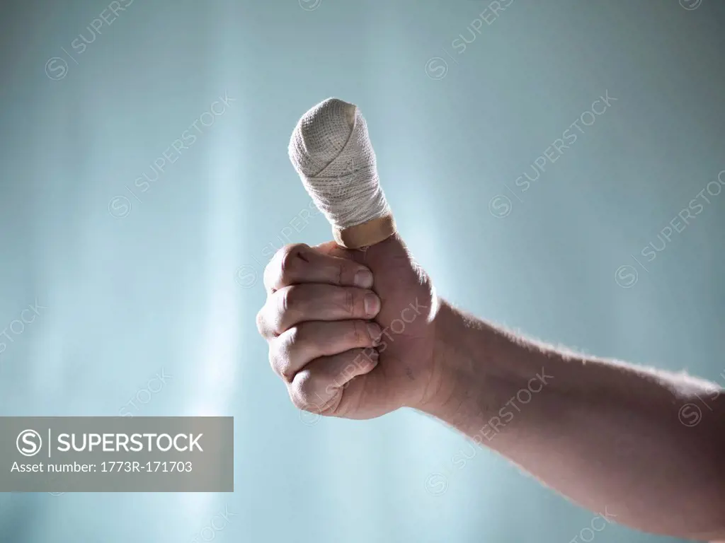 Close up of hand with bandaged thumb