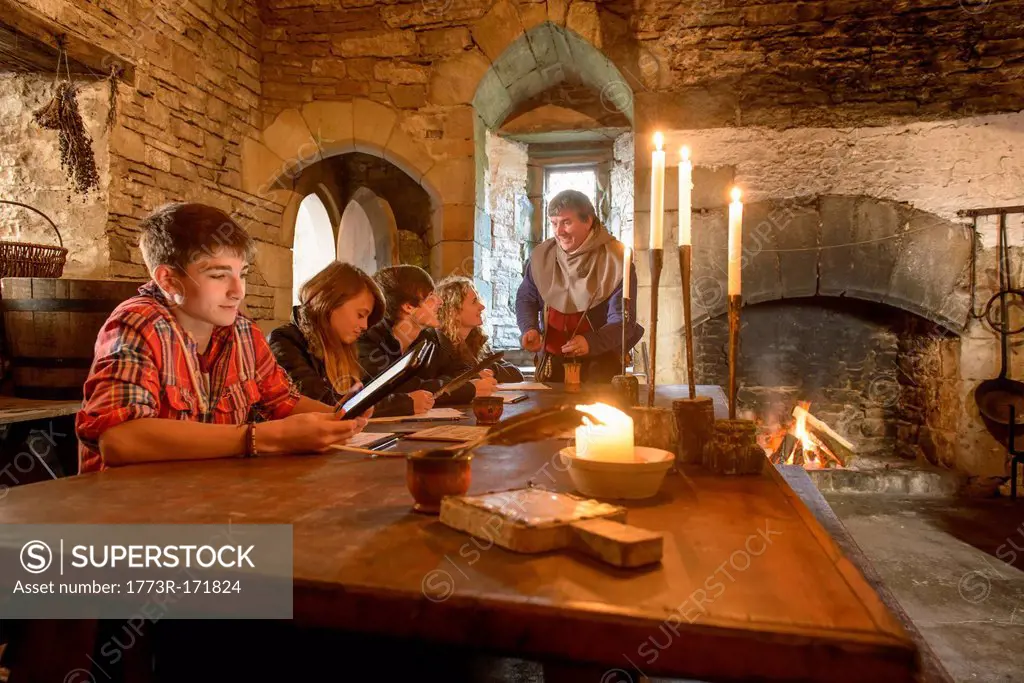 Students reading history in castle