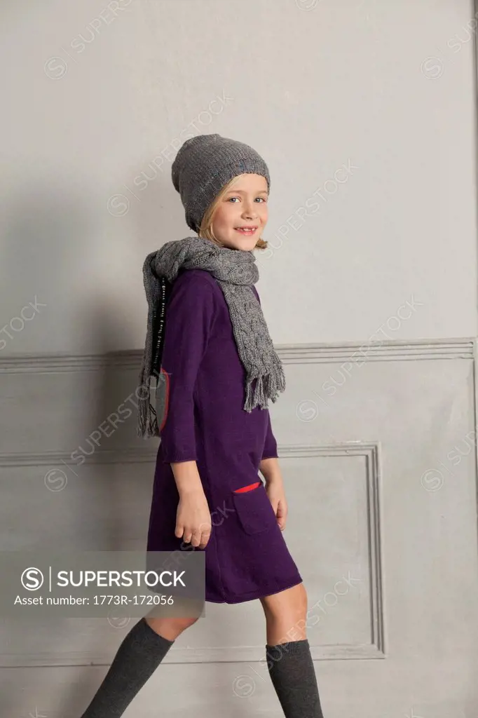 Girl wearing scarf and hat indoors