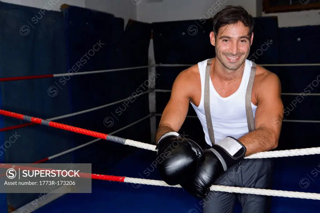 Smiling boxer standing in ring
