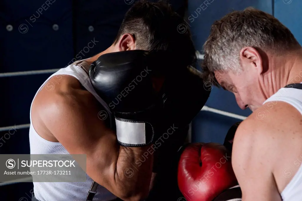 Boxers sparring in ring