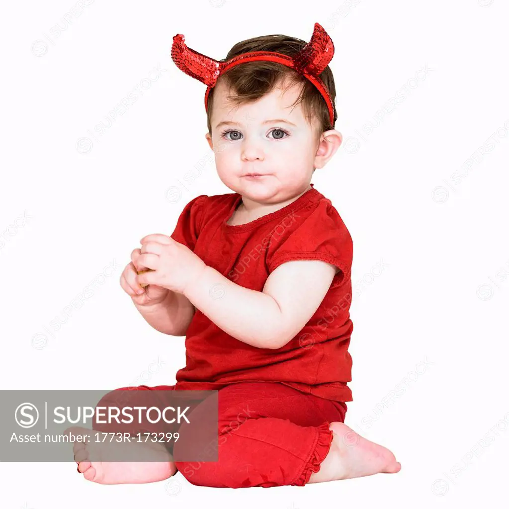 Toddler girl wearing devil costume