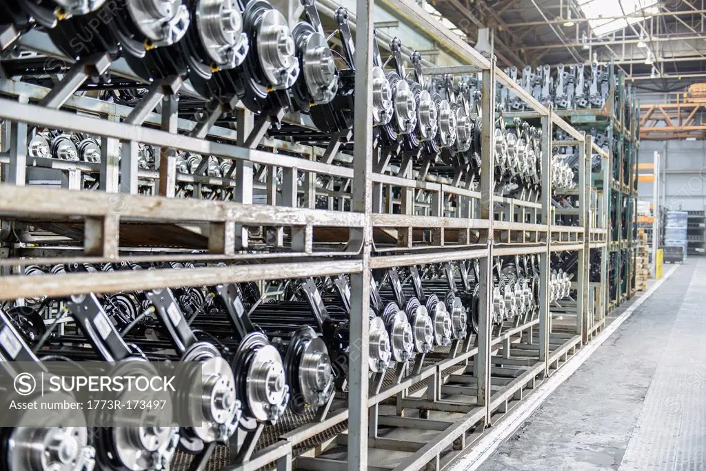 Shelves of axles in car factory