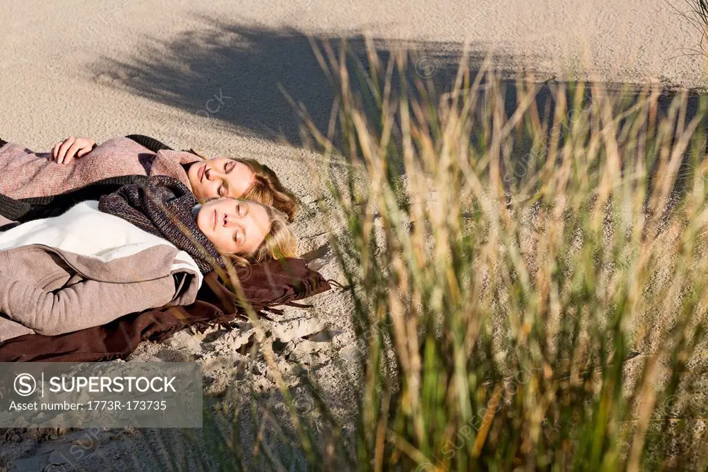 Women napping on beach