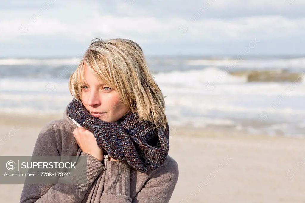 Woman wearing scarf on beach