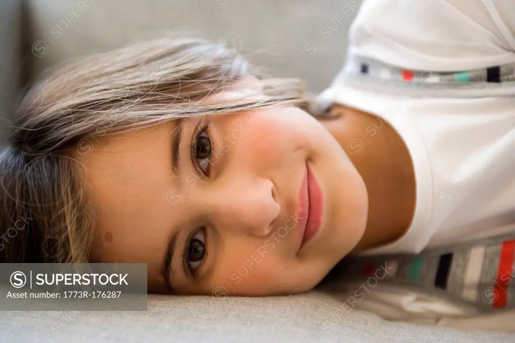 Girl lying and looking into the camera