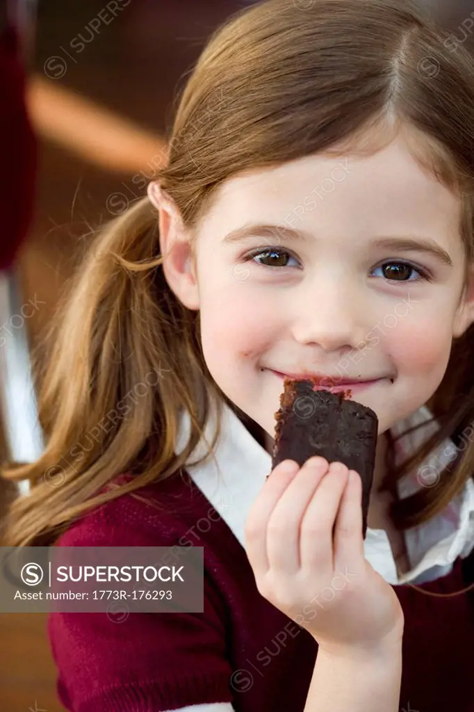 Girl eating chocolate cake