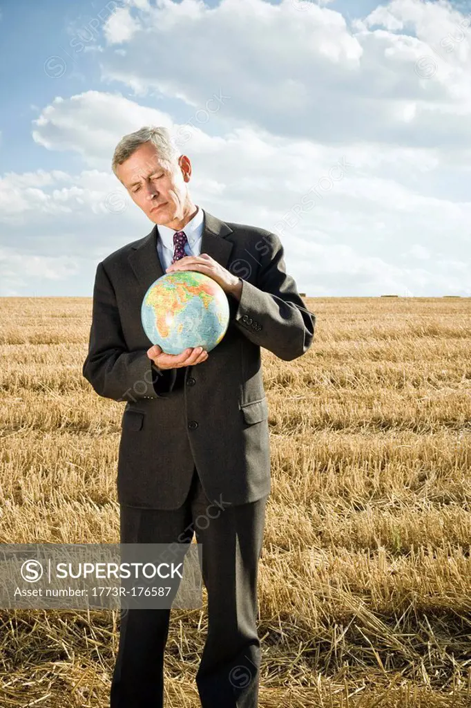 Businessman in a wheat field